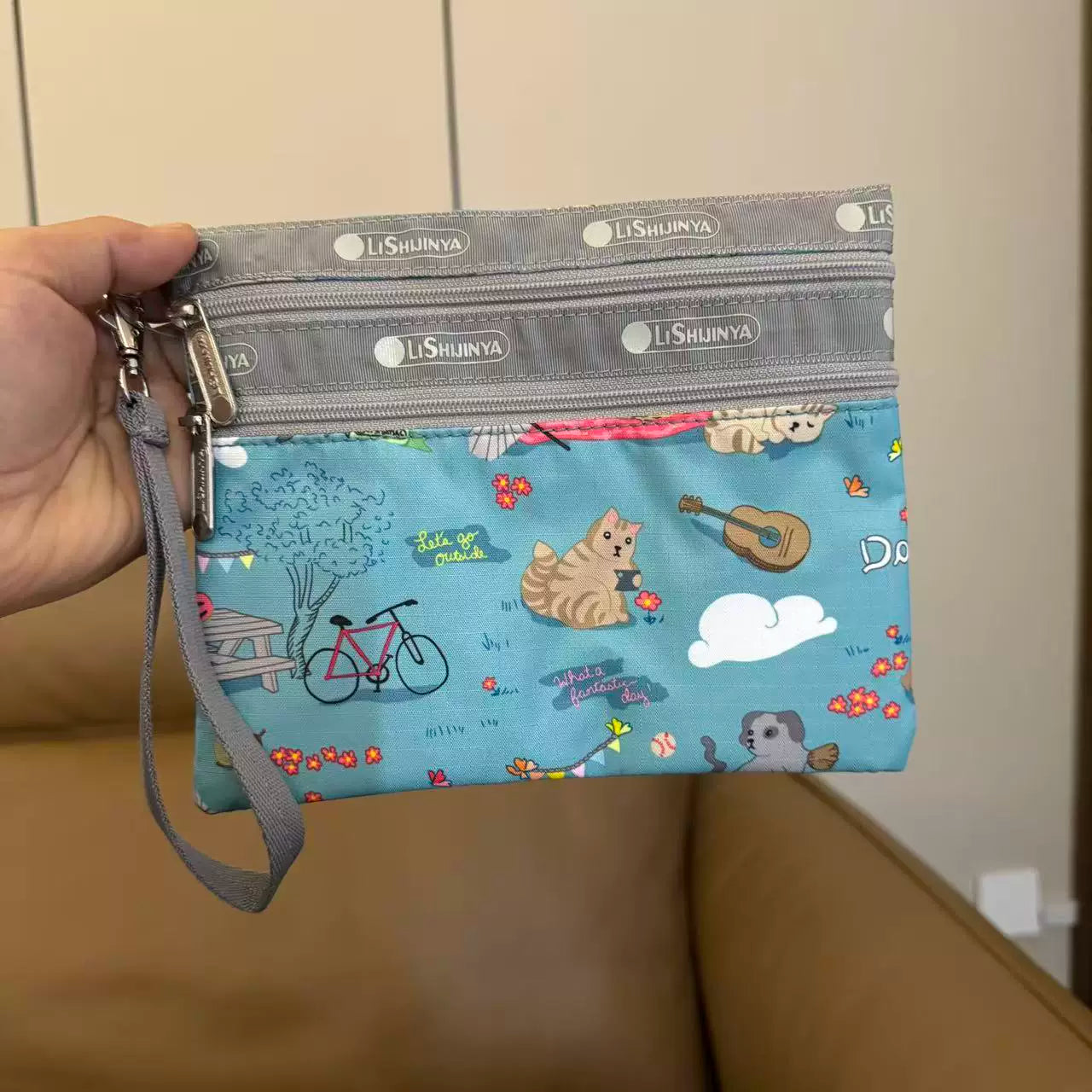 Cartoon women's hand rope, hand bag, two zippers, cosmetic bag, change bag, mobile phone bag.