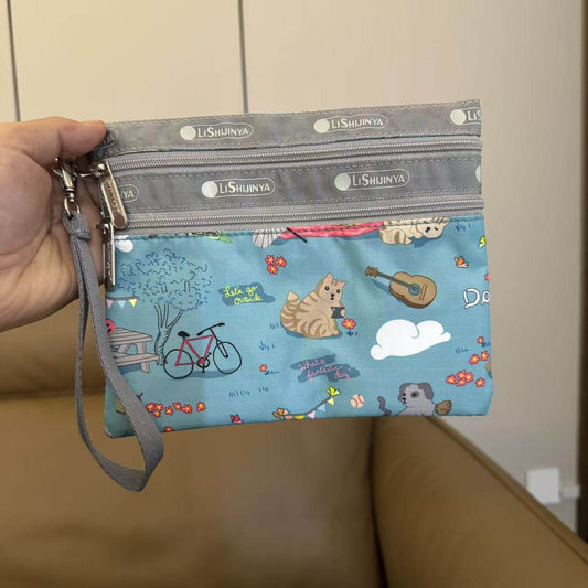 Cartoon women's hand rope, hand bag, two zippers, cosmetic bag, change bag, mobile phone bag.